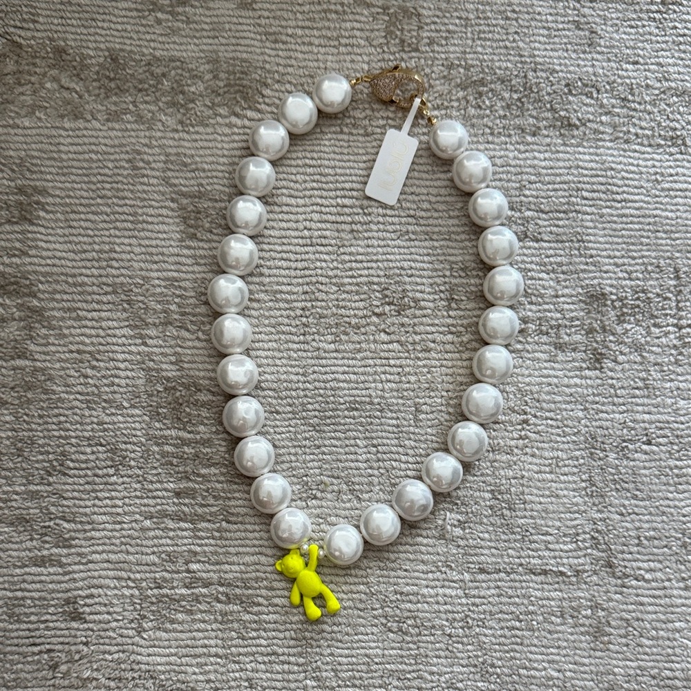 White Beaded Necklace with Yellow Charm